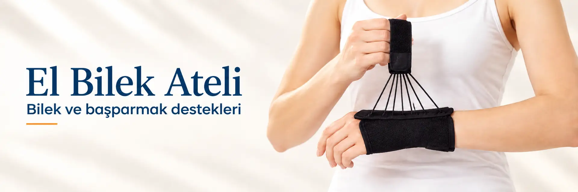 El Bilek Ateli: Bilek ve başparmak destekleri. Siyah el bileği ve başparmak desteğinin model üzerinde sunumu.