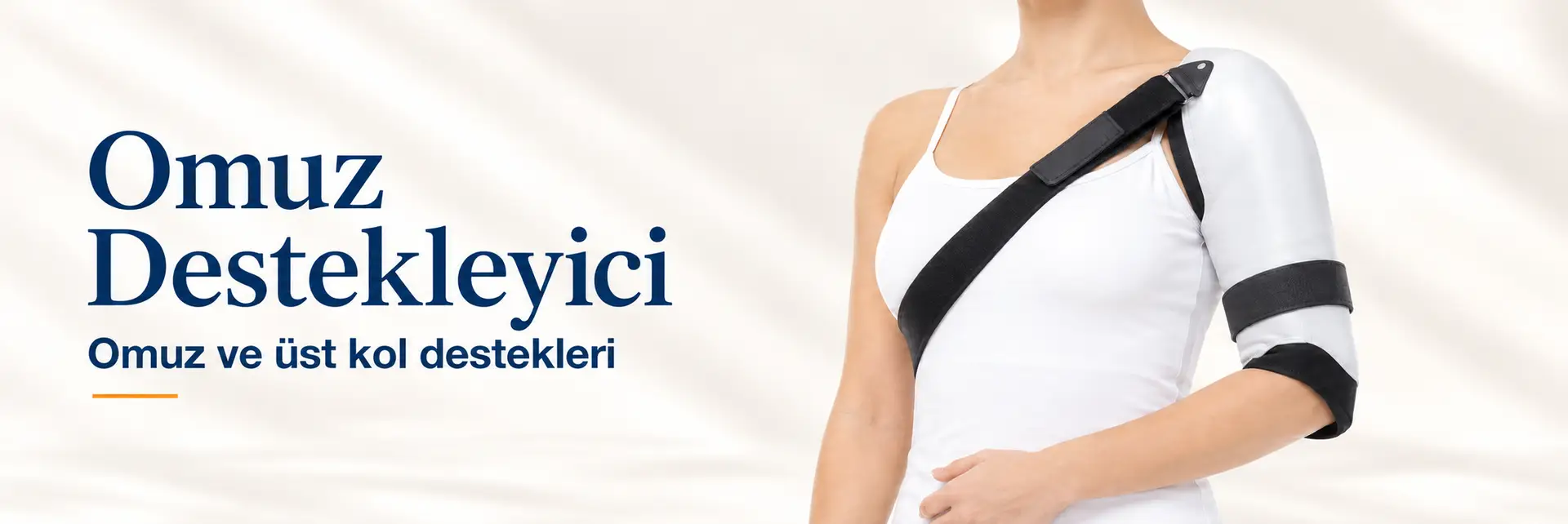 Omuz Destekleyici: Omuz ve üst kol destekleri. Beyaz üst kol ve omuz desteğinin model üzerinde sunumu.